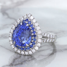 Load image into Gallery viewer, 6.08ct Pear Shaped Blue Sapphire Ring with Sapphire and Diamond halo in 18K White Gold