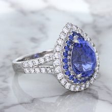 Load image into Gallery viewer, 6.08ct Pear Shaped Blue Sapphire Ring with Sapphire and Diamond halo in 18K White Gold