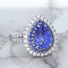 Load image into Gallery viewer, 6.08ct Pear Shaped Blue Sapphire Ring with Sapphire and Diamond halo in 18K White Gold