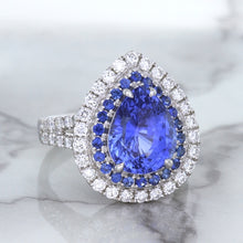 Load image into Gallery viewer, 6.08ct Pear Shaped Blue Sapphire Ring with Sapphire and Diamond halo in 18K White Gold