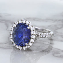 Load image into Gallery viewer, 7.86ct Oval Blue Sapphirewith diamond halo in 18K White Gold