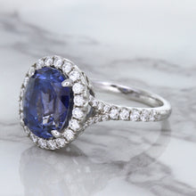 Load image into Gallery viewer, 7.86ct Oval Blue Sapphirewith diamond halo in 18K White Gold