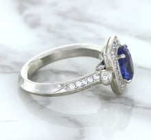 Load image into Gallery viewer, 1.56ct Oval Blue Sapphire Ring with Diamond Halo in Platinum