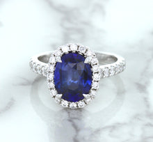 Load image into Gallery viewer, 3.68ct. Oval GIA Certified Blue Sapphire Ring with Diamond Halo in 18K White Gold