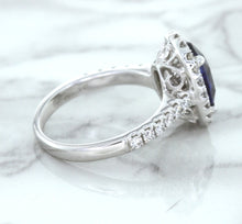 Load image into Gallery viewer, 3.68ct. Oval GIA Certified Blue Sapphire Ring with Diamond Halo in 18K White Gold