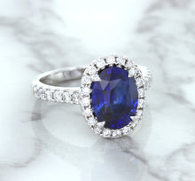 Load image into Gallery viewer, 3.68ct. Oval GIA Certified Blue Sapphire Ring with Diamond Halo in 18K White Gold
