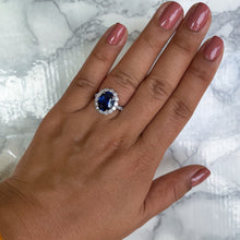 Load image into Gallery viewer, 4.79ct. Oval Blue Sapphire Ring with Diamond Halo in 18K White Gold