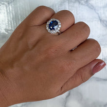Load image into Gallery viewer, 4.45ct. Oval Blue Sapphire GIA Certified Ring with Diamond Halo in 18K White Gold