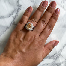 Load image into Gallery viewer, 6.58ct Oval Orangey Peach Sapphire with diamond halo in 18K White Gold