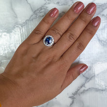 Load image into Gallery viewer, 4.45ct. Oval Blue Sapphire GIA Certified Ring with Diamond Halo in 18K White Gold