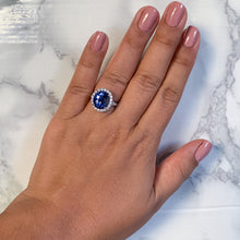 Load image into Gallery viewer, 7.86ct Oval Blue Sapphirewith diamond halo in 18K White Gold