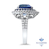 6.08ct Pear Shaped Blue Sapphire with sapphire and diamond halo in 18K White Gold
