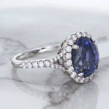 Load image into Gallery viewer, 7.86ct Oval Blue Sapphirewith diamond halo in 18K White Gold
