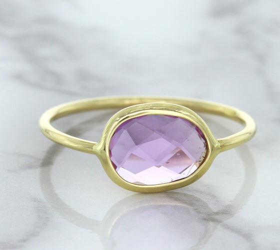 1.45ct. Oval Pink Sapphire Ring in 14K Yellow Gold