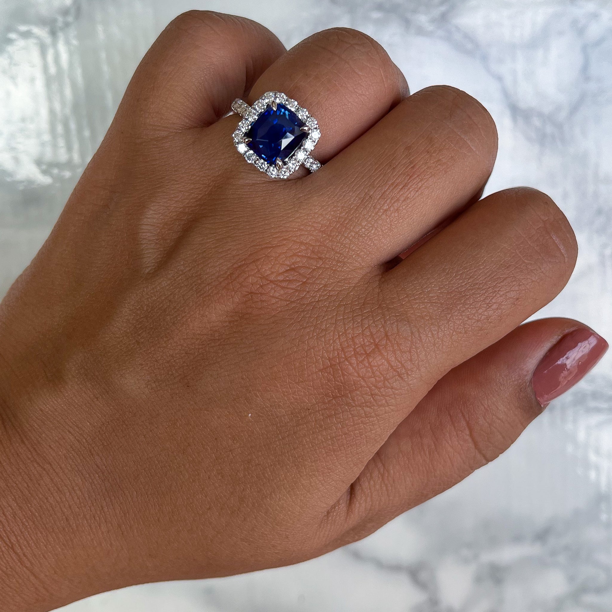 4.41ct. Cushion Blue Sapphire Ring with Diamond Halo in 18K 4.41ct. Cushion Blue Sapphire Ring with Diamond Halo in 18K