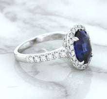 Load image into Gallery viewer, 3.68ct. Oval GIA Certified Blue Sapphire Ring with Diamond Halo in 18K White Gold
