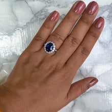 Load image into Gallery viewer, 4.79ct. Oval Blue Sapphire Ring with Diamond Halo in 18K White Gold
