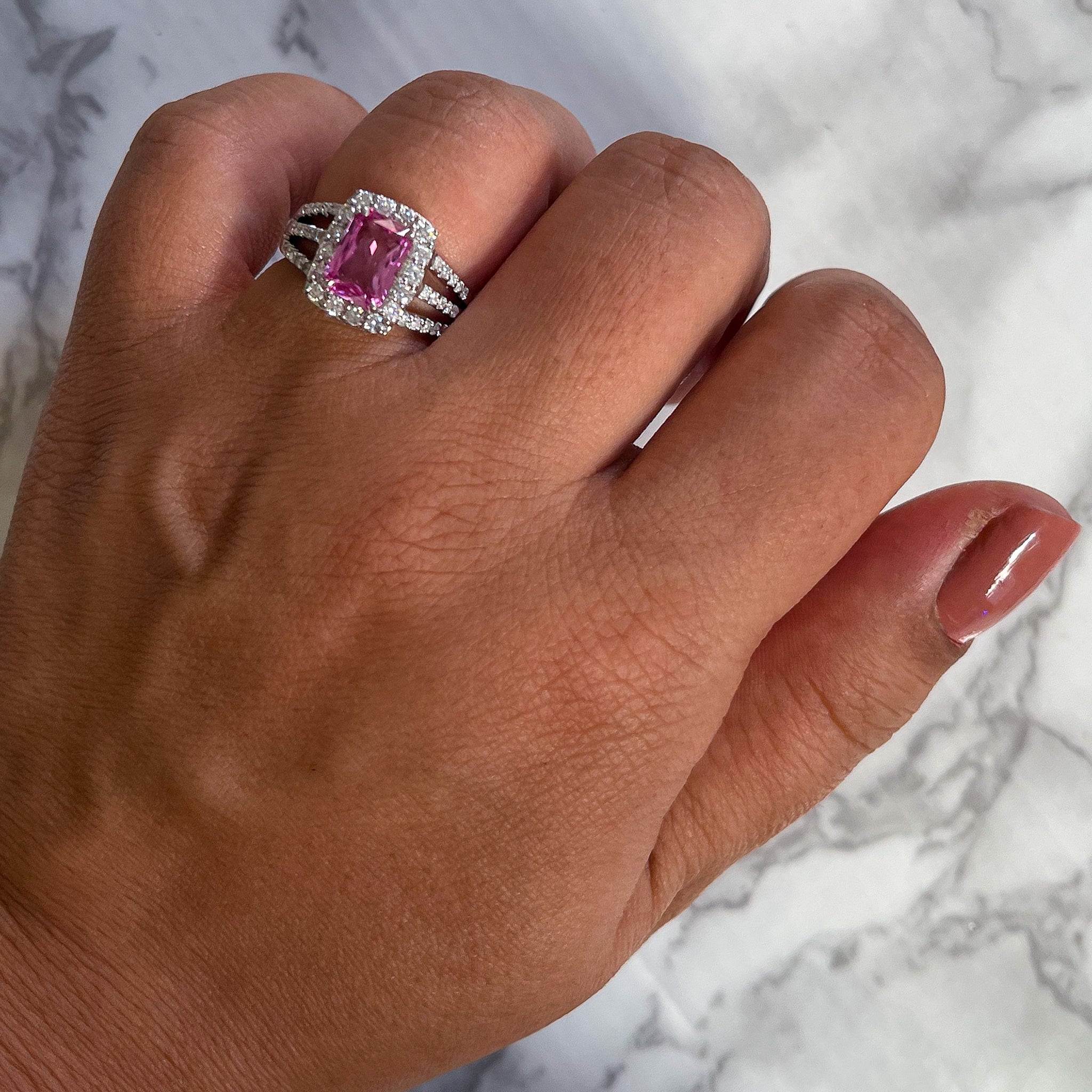 2.25ct Emerald Cut Pink Sapphire Ring with Diamond halo in 18K