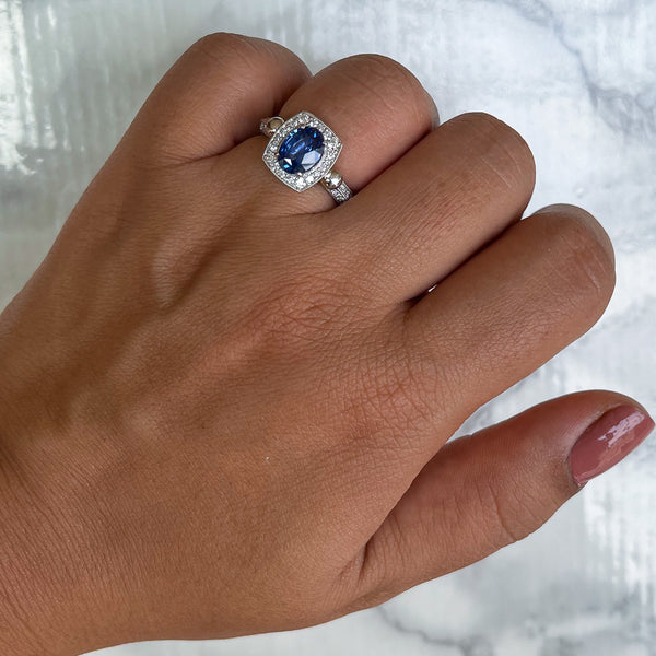 1.56ct Oval Blue Sapphire Ring with Diamond Halo in Platinum